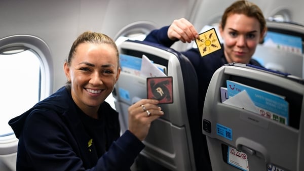 Republic of Ireland's Katie McCabe, left, and Aoife Mannion onboard their chartered flight to Amsterdam's Schiphol Airport as Republic of Ireland women travel to the Netherlands for their 2027 FIFA Women’s World Cup Qualifier against the Netherlands in Ut