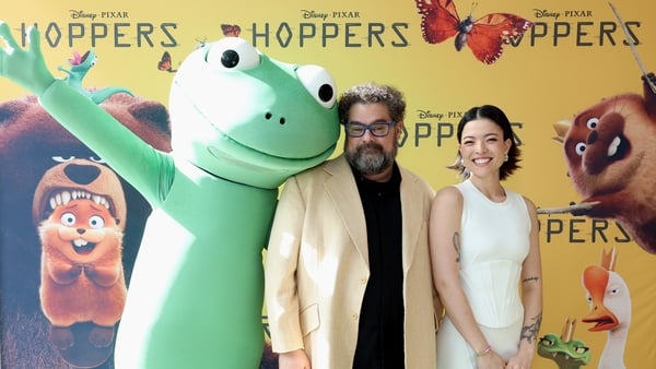 (L-R) Character Tom Lizard with Bobby Moynihan and Piper Curda attend the Hoppers Day Event in Beaverton, Oregon on 5 March, 2026. (Photo by Mat Hayward/Getty Images for Disney)
