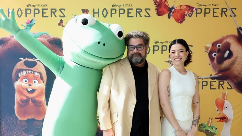 (L-R) Character Tom Lizard with Bobby Moynihan and Piper Curda attend the Hoppers Day Event in Beaverton, Oregon on 5 March, 2026. (Photo by Mat Hayward/Getty Images for Disney)