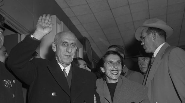 Premier of Iran Mohammad Mosaddegh and his daughter, Zia, wave and smile before leaving New York International Airport for home on Nov. 18, 1951. (Hy Rothman / New York Daily News via Getty Images)