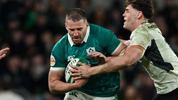 6 March 2026; Stuart McCloskey of Ireland is tackled by Wales players Josh Adams, left, and Eddie James during the Guinness 6 Nations Rugby Championship match between Ireland and Wales at the Aviva Stadium in Dublin. Photo by Ramsey Cardy/Sportsfile
