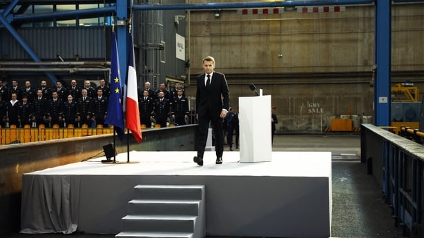 France's President Emmanuel Macron leaves the stage during his visit to the Nuclear Submarine Navy Base of Ile Longue.