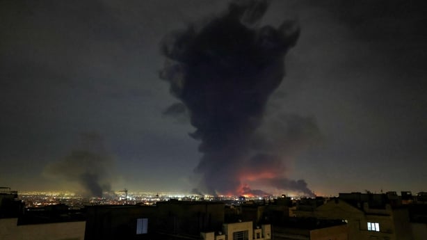 Smoke rises from the site of airstrikes at Mehrabad International Airport in Tehran.