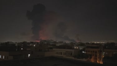 Fire and smoke rise over Tehran as strikes persist into the night