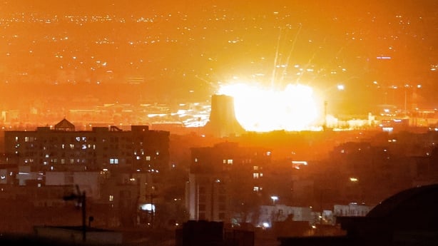 An explosion erupts following strikes near Azadi Tower close to Mehrabad International Airport in Tehran 