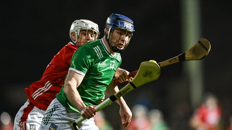 7 March 2026; Shane O’Brien of Limerick on his way to scoring his side's first goal despite the attention of Dáire O'Leary of Cork during the Allianz Hurling League Division 1A match between Limerick and Cork at TUS Gaelic Grounds in Limerick. Photo by To
