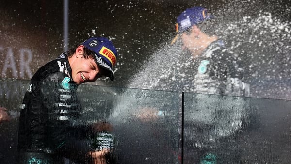 MELBOURNE, AUSTRALIA - MARCH 08: Race winner George Russell of Great Britain and Mercedes AMG Petronas F1 Team and Second placed Andrea Kimi Antonelli of Italy and Mercedes AMG Petronas F1 Team celebrate on the podium during the F1 Grand Prix of Australia