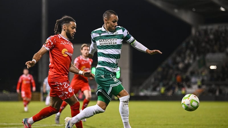 10 October 2025; Graham Burke of Shamrock Rovers in action against Milan Mbeng of Shelbourne during the SSE Airtricity Men's Premier Division match between Shamrock Rovers and Shelbourne at Tallaght Stadium in Dublin. Photo by Seb Daly/Sportsfile