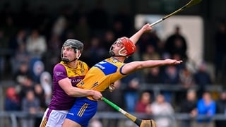 8 March 2026; Peter Duggan of Clare and Conor Foley of Wexford tussle during the Allianz Hurling League Division 1B match between Clare and Wexford at Zimmer Biomet Páirc Chíosóg in Ennis, Clare. Photo by Piaras Ó Mídheach/Sportsfile