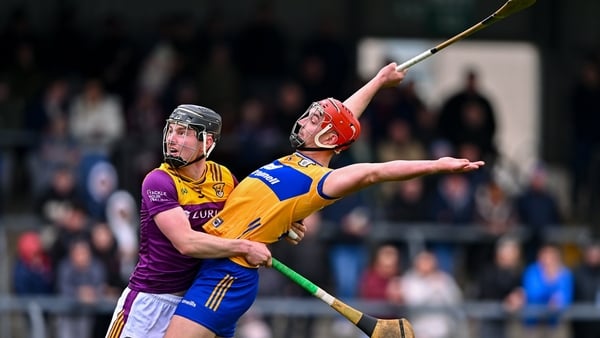 8 March 2026; Peter Duggan of Clare and Conor Foley of Wexford tussle during the Allianz Hurling League Division 1B match between Clare and Wexford at Zimmer Biomet Páirc Chíosóg in Ennis, Clare. Photo by Piaras Ó Mídheach/Sportsfile