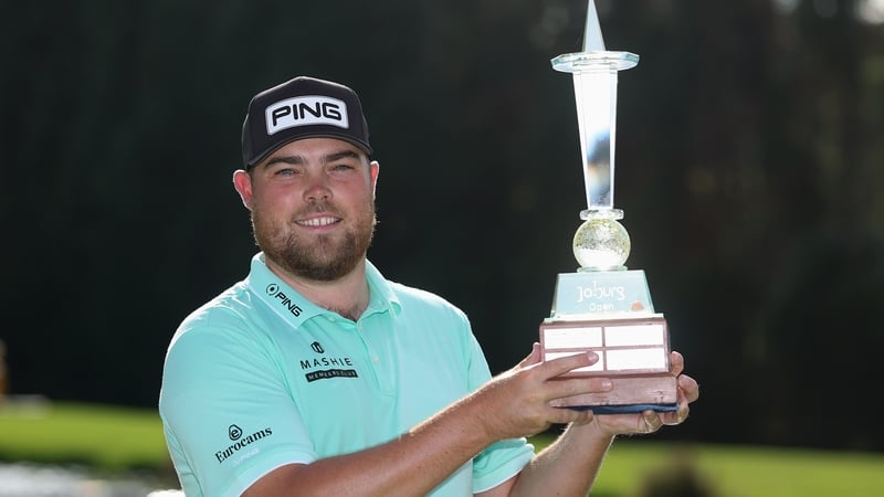 JOHANNESBURG, SOUTH AFRICA - MARCH 08: Dan Bradbury of England kisses the trophy following victory of the 2026 Joberg Open on day four of the Joburg Open 2026 at Houghton GC on March 08, 2026 in Johannesburg, South Africa. (Photo by Warren Little/Getty Im