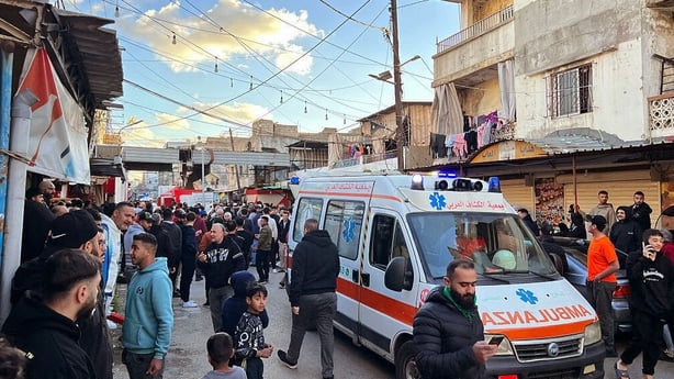 First aid responders are seen at the site of an Israeli airstrike that targeted an area in the Palestinian refugees camp of Ain al-Helweh