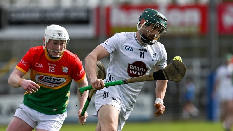 Gerry Keegan of Kildare is pursued by Eric English of Carlow - Allianz HL Division 1B, March 2026