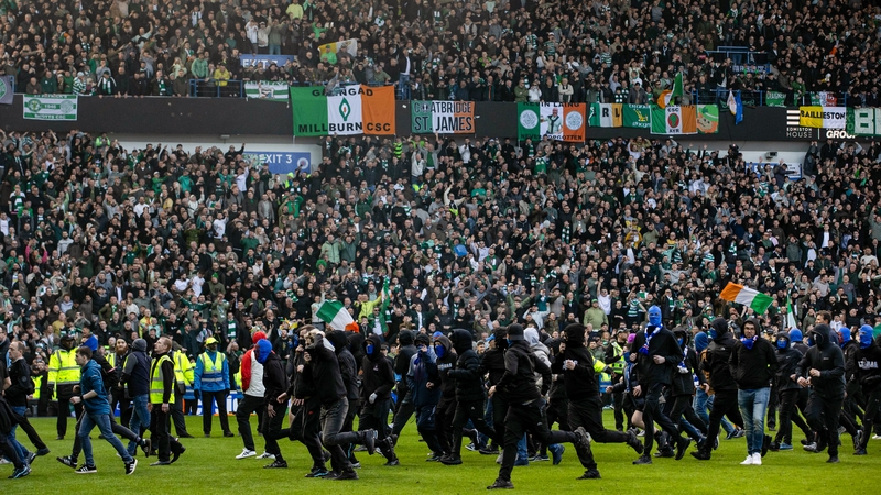 GLASGOW, SCOTLAND - MARCH 08: Fans storm the pitch at full time during a Scottish Gas Scottish Cup Quarter-Final match between Rangers and Celtic at Ibrox Stadium, on March 08, 2026, in Glasgow, Scotland. (Photo by Alan Harvey/SNS Group via Getty Images)