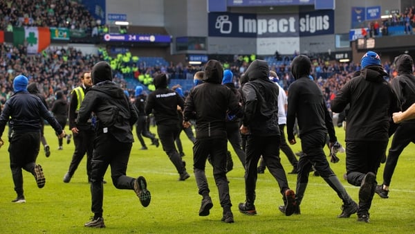 Rangers ultras run onto the pitch during a Scottish Gas Scottish Cup Quarter-Final match between Rangers and Celtic at Ibrox Stadium, on March 08, 2026, in Glasgow, Scotland. (Photo by Alan Harvey/SNS Group via Getty Images)