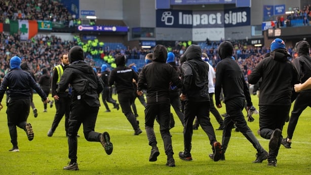 Rangers ultras run onto the pitch during a Scottish Gas Scottish Cup Quarter-Final match between Rangers and Celtic at Ibrox Stadium, on March 08, 2026, in Glasgow, Scotland. (Photo by Alan Harvey/SNS Group via Getty Images)