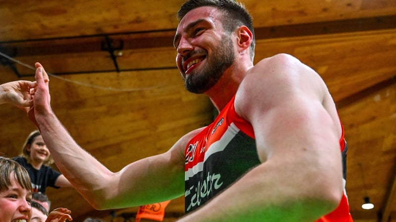 18 January 2025; Baptiste Chazelas of Killester celebrates with supporters after his side's victory in the Basketball Ireland Men's Pat Duffy National Cup final match between Killester and UCC Demons at the National Basketball Arena in Tallaght, Dublin. P