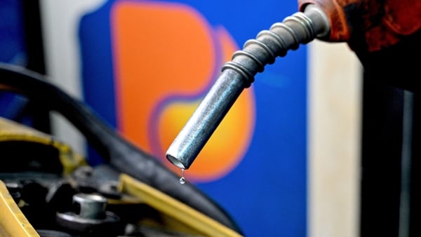 An employee pumps gasoline into the vehicle of a customer at a gas station in Hanoi on March 9, 2026. Vietnam is considering a plan to scrap tariffs on fuel imports, the government said, as the US-Israeli war with Iran disrupts oil supplies and pushes pri