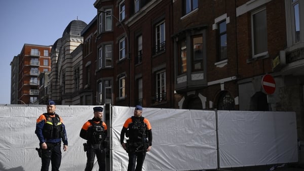 Belgian police man the perimeter around a synagogue on Leon Fredericq street after it was struck overnight by a blast in Liege