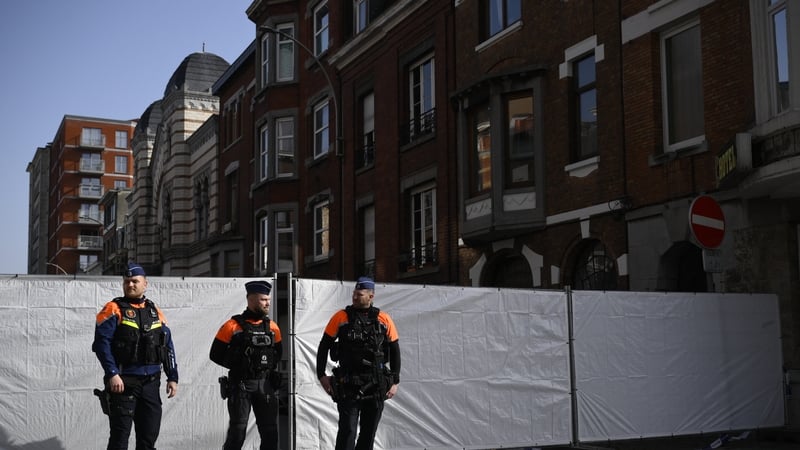 Belgian police man the perimeter around a synagogue on Leon Fredericq street after it was struck overnight by a blast in Liege