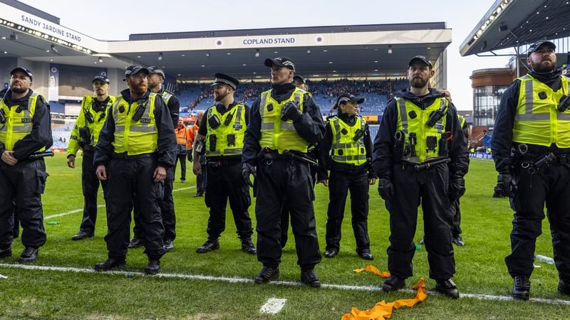 GLASGOW, SCOTLAND - MARCH 08: Police line up to block fans from storming the pitch during a Scottish Gas Scottish Cup Quarter-Final match between Rangers and Celtic at Ibrox Stadium, on March 08, 2026, in Glasgow, Scotland. (Photo by Craig Williamson/SNS