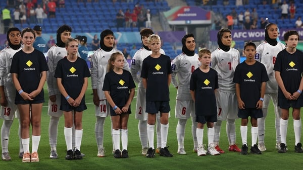 Iranian soccer players refused to sing the national anthem before their Asian Cup match against South Korea