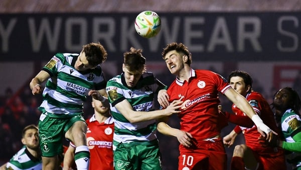 9 March 2026; John Martin of Shelbourne in action against John McGovern, left, and Matt Healy of Shamrock Rovers during the SSE Airtricity Men's Premier Division match between Shelbourne and Shamrock Rovers at Tolka Park in Dublin. Photo by Ramsey Cardy/S