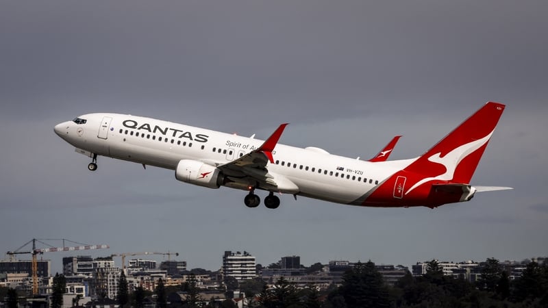 A Qantas Airways Boeing 737 aircraft takes off from Sydney International Airport