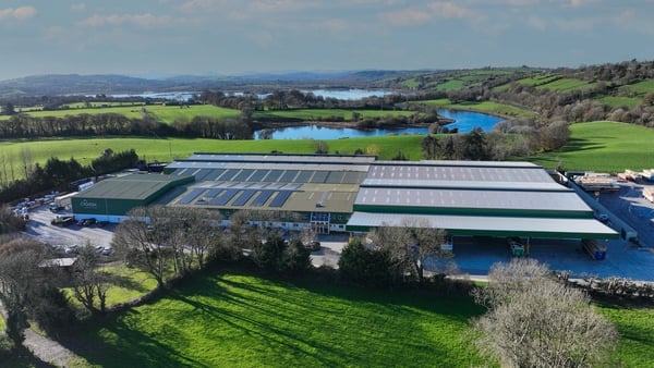 Aerial view of a big factory surrounded by fields