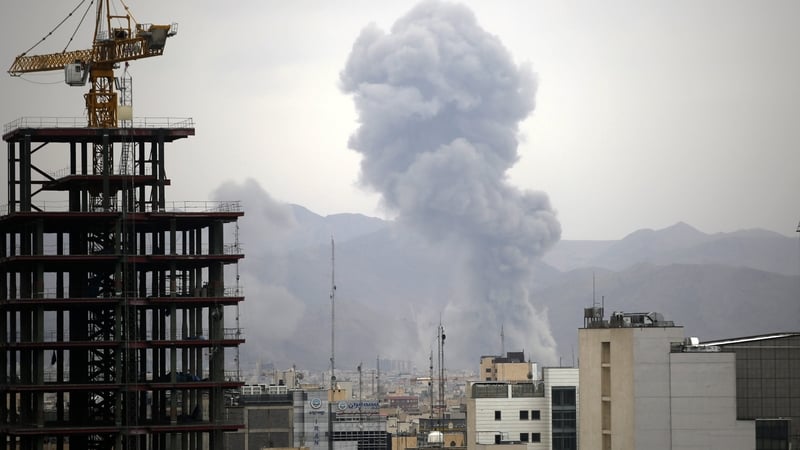 Smoke rises among residential buildings in Tehran