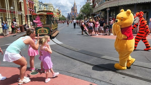 Young guests enjoy seeing Winnie The Pooh, and Tiggerat the Magic Kingdom at Walt Disney World, in Lake Buena Vista, Florida, on May 17, 2021.