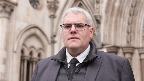 A photo of dup leader Gavin robinson outside the high court in London