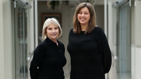 Caroline Bergin and Elizabeth O Reilly WEEE Ireland stand and pose for a photo outside an office building