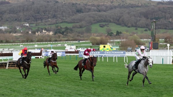 Jockey Paul Townend (R) rides Lossiemouth to win ahead of second-placed Brighterdaysahead ridden by Brighterdaysahead (C) in the Unibet Champion Hurdle Challenge Trophy horse race on the first day of the Cheltenham Festival at Cheltenham Racecourse, in Ch