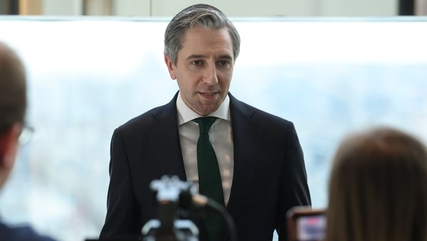 Tánaiste and Finance Minister Simon Harris speaking to the travelling media in Paris during his visit to France