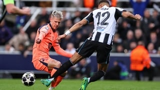 NEWCASTLE UPON TYNE, ENGLAND - MARCH 10: Malick Thiaw of Newcastle United brings down Dani Olmo of FC Barcelona for a penalty during the UEFA Champions League 2025/26 Round of 16 First Leg match between Newcastle United FC and FC Barcelona at St James' Pa