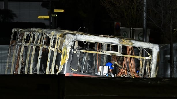 A forensic officer works in a screened-off area inside a bus that caught fire, killing at least six people and injuring five others in what police said may have been a deliberate act, in the town of Kerzers, western Switzerland, on March 11, 2026. A bus caught fire in western Switzerland on March 10