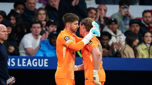 MADRID, SPAIN - MARCH 10: Guglielmo Vicario of Tottenham Hotspur embraces his teammate Antonin Kinsky who was substituted after 17 minutes during the UEFA Champions League 2025/26 Round of 16 First Leg match between Atletico de Madrid and Tottenham Hotspu