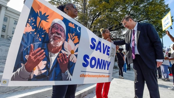 Daughters of Charles 'Sonny' Burton, Lois Bradford Harris, left, and Carolyn Shavers ahead of a march to the Alabama State Capitol in Montgomery on Monday