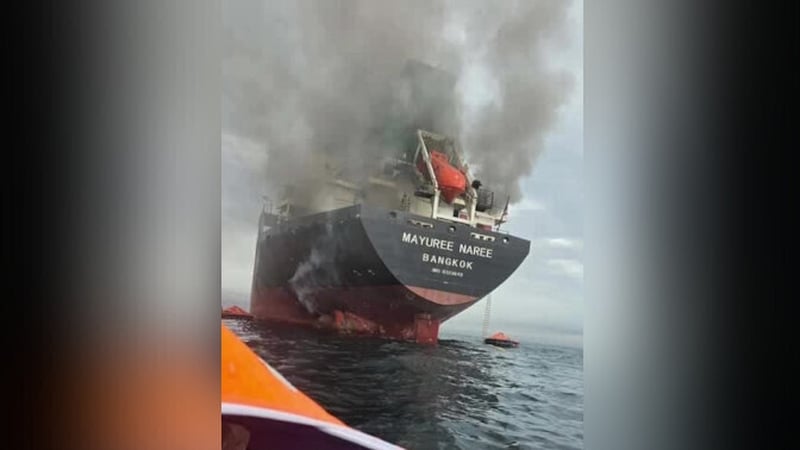 a view of a cargo ship on fire