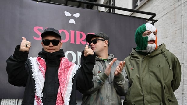 BELFAST, NORTHERN IRELAND - MARCH 11: (L-R) Liam Óg Ó hAnnaidh, aka Mo Chara, Naoise Ó Cairealláin, aka Móglaí Bap and J. J. Ó Dochartaigh, aka DJ Próvaí, of the band Kneecap attend a press conference following a High Court ruling which upheld the decision to drop the terrorism case against Liam Og 