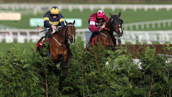 CHELTENHAM, ENGLAND - MARCH 11: Conor Stone-Walsh (L) riding Final Orders and Jack Kennedy (R) riding Favori De Champdou jumps the last fence in the Glenfarclas Cross Country Chase on Ladies Day during day two of the Cheltenham Festival at Cheltenham Race