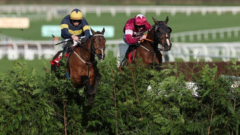 CHELTENHAM, ENGLAND - MARCH 11: Conor Stone-Walsh (L) riding Final Orders and Jack Kennedy (R) riding Favori De Champdou jumps the last fence in the Glenfarclas Cross Country Chase on Ladies Day during day two of the Cheltenham Festival at Cheltenham Race