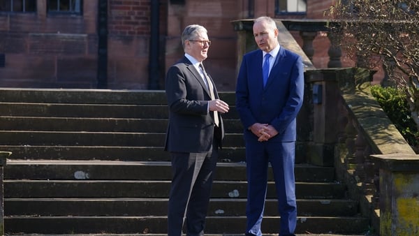 UK Prime Minister Sir Keir Starmer (left) speaks with Irish Taoiseach Micheal Martin in the gardens during a summit at Inglewood Manor House in Ellesmere Port