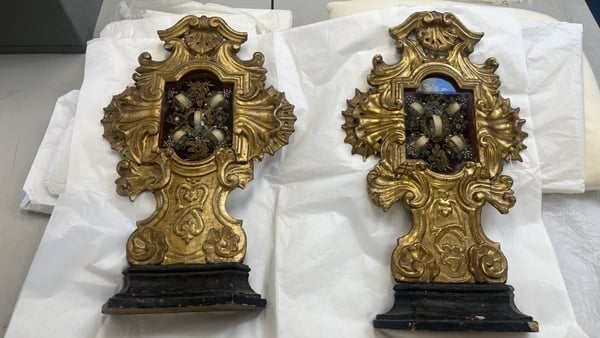 Two reliquaries side by side on a table