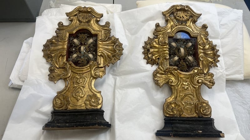 Two reliquaries side by side on a table