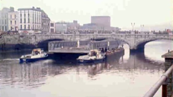 A Bailey Bridge is manoeuvred by tugs under St Patrick's Bridge in Cork City in 1981.
