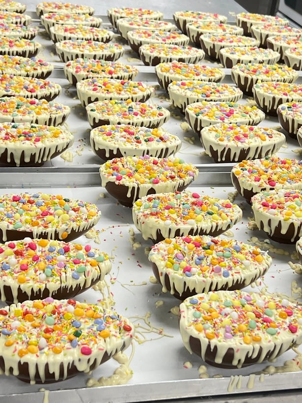Easter eggs filled with white chocolate and sprinkles