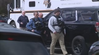 Police arrive on the scene of an active shooter at a synagogue in Michigan