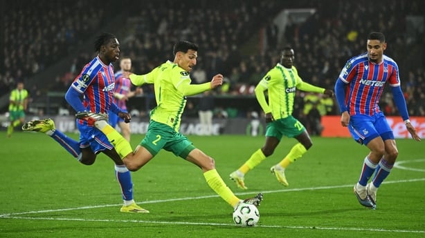 LONDON, ENGLAND - MARCH 12: Petros Ioannou of AEK Larnaca passes the ball under pressure from Jaydee Canvot and Maxence Lacroix of Crystal Palace during the UEFA Conference League 2025/26 round of 16 first leg match between Crystal Palace FC and AEK Larnaca FC at Selhurst Park on March 12, 2026 in L